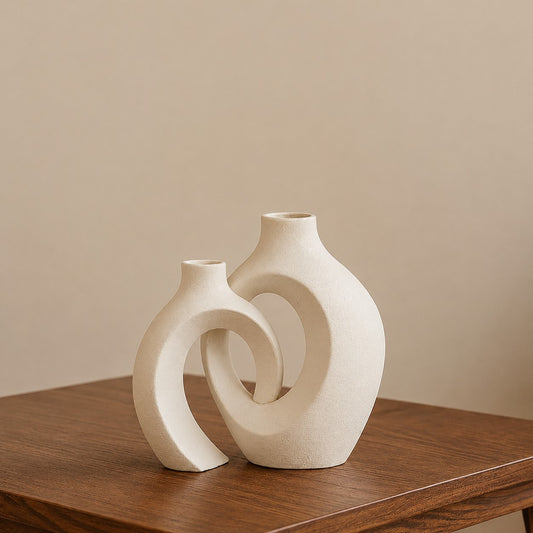 Corelz Lifestyle modern interlocking ceramic vase in off-white with a textured matte finish on a wooden table.