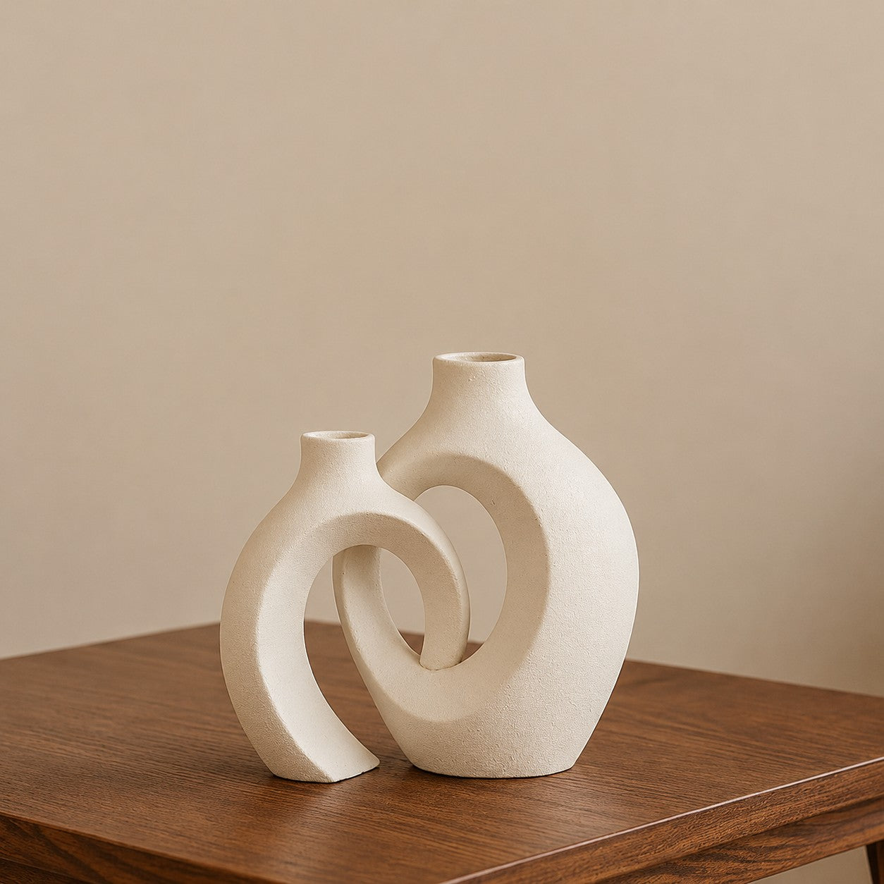 Corelz Lifestyle modern interlocking ceramic vase in off-white with a textured matte finish on a wooden table.